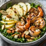 Apple almond shrimp salad with apples, greens, and toasted almonds