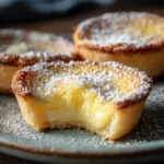 Close-up of baby lemon impossible pies with golden crust and creamy center