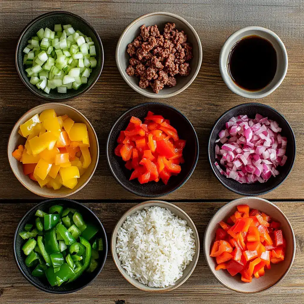 Raw ingredients for beef and pepper rice bowl on a wooden table