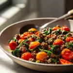 Mediterranean ground beef stir fry with blistered tomatoes and sautéed spinach