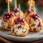 Two-Bite Cranberry Cheese Ball Pops appetizer with cranberries and pecans