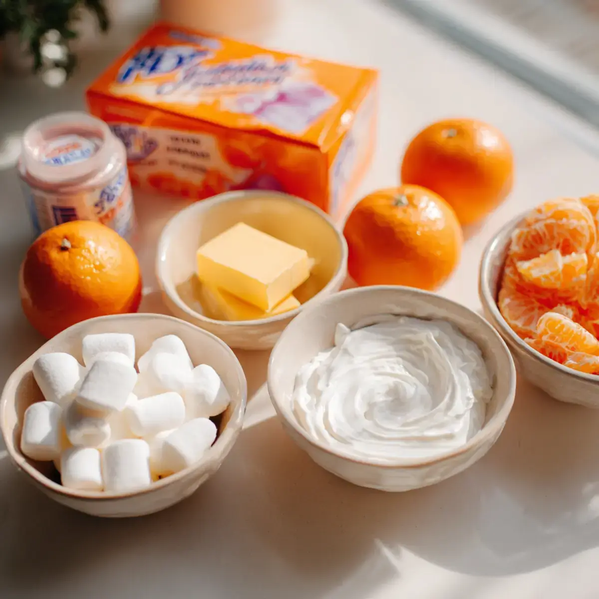 Ingredients for Orange Dreamsicle Salad arranged on kitchen counter