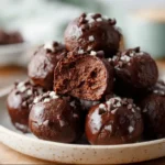 No-Bake Cottage Cheese Brownie Batter Bites stacked on plate