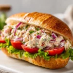 Jersey Mike's chicken salad recipe served on a toasted sub roll with lettuce and tomatoesv