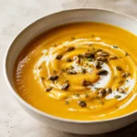 Creamy roasted butternut squash soup with pepitas and thyme