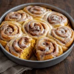 Soft pumpkin cinnamon rolls with cream cheese frosting